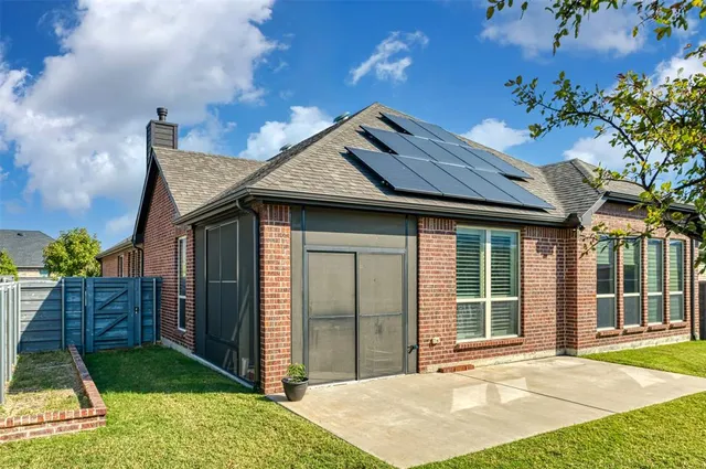 a view of backyard with swimming pool and seating