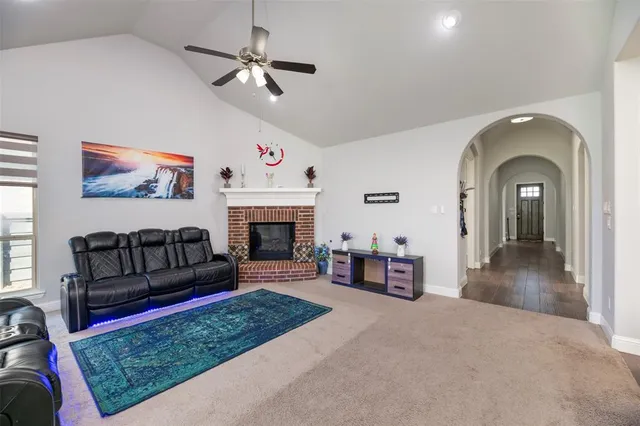 a living room with furniture or couch and a fireplace
