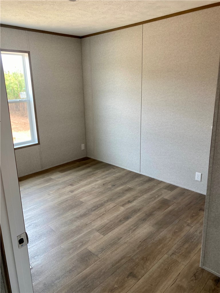 384 Skippers Lodge Road Cross Hill, SC 29332 - Photo 11 of 47 This versatile room offers ample space, perfect for an office or bedroom.