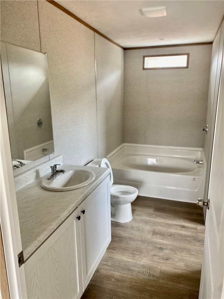 384 Skippers Lodge Road Cross Hill, SC 29332 - Photo 17 of 47 This bathroom features a sleek vanity, modern fixtures, and a relaxing bathtub.