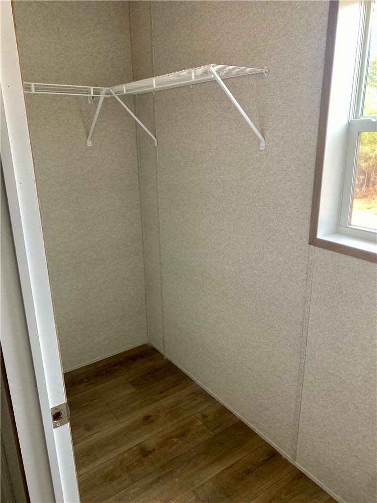 384 Skippers Lodge Road Cross Hill, SC 29332 - Photo 20 of 47 Functional closet with ample storage space and natural light.