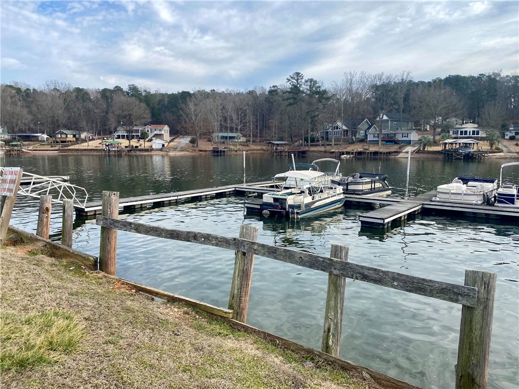 384 Skippers Lodge Road Cross Hill, SC 29332 - Photo 45 of 47 This serene waterfront setting offers direct access to the lake with private boat docks.