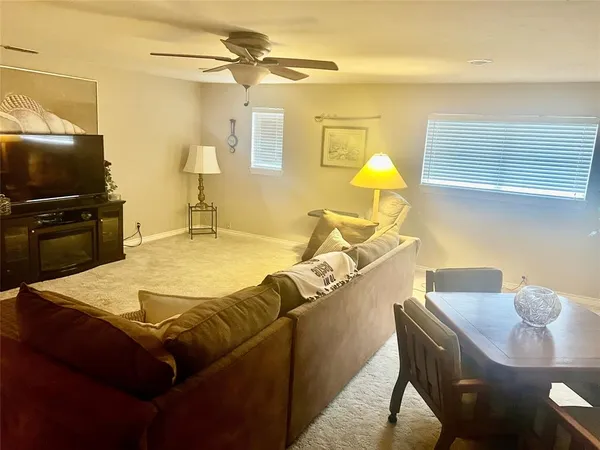 a living room with a couch and a flat screen tv
