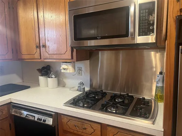 a kitchen with a stove and a microwave