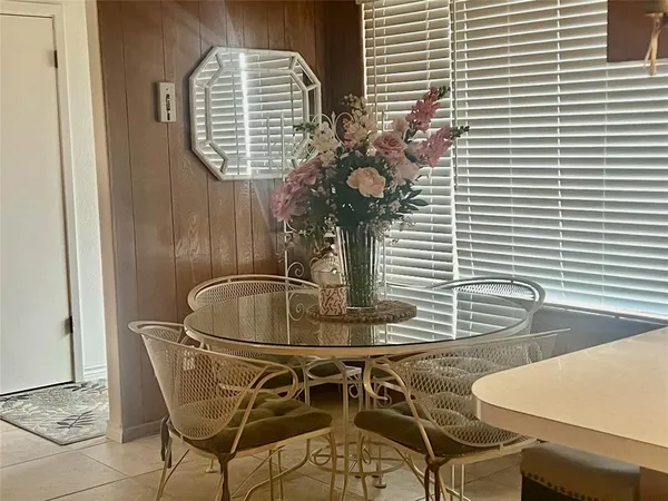 a table and chairs in a balcony
