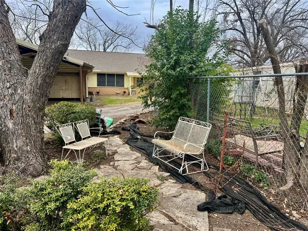a view of a patio with two chairs in a patio