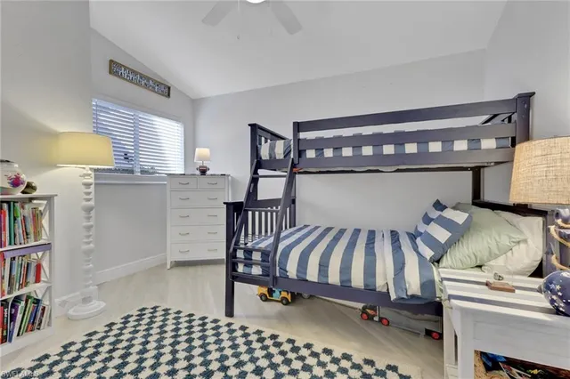 a bedroom with furniture and a book shelf