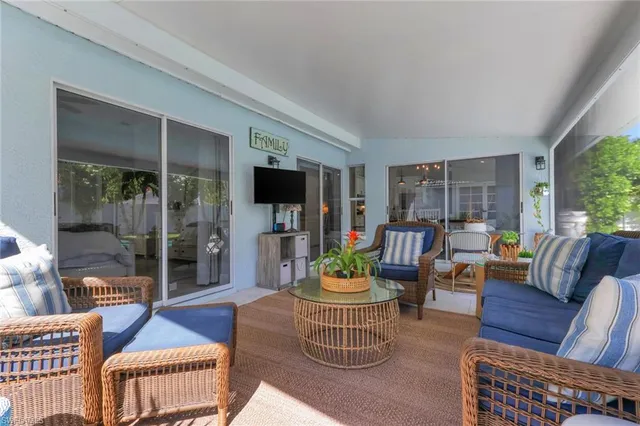 a outdoor living space with furniture a rug and a window