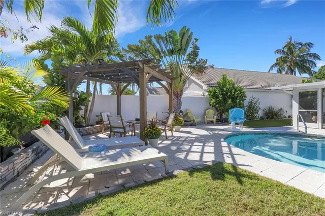 a view of a backyard with a patio