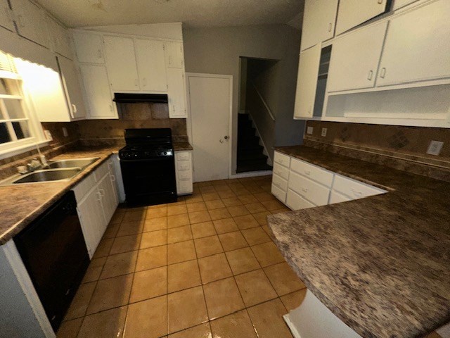 38 Bethesda Church Road Lawrenceville, GA 30044 - Photo 5 of 14 a kitchen with granite countertop a stove a sink and a microwave