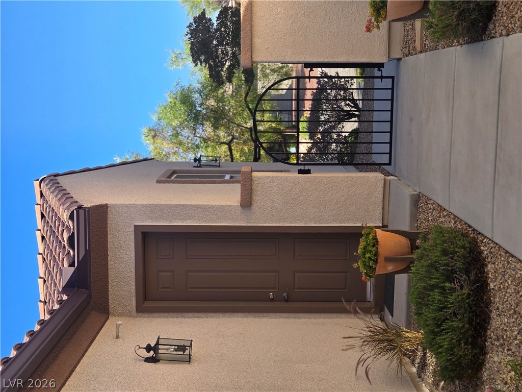 2567 Dirleton Place Henderson, NV 89044 - Photo 48 of 67 Casita Location at front of entry. An inviting entry with a tiled roof and secure gate creates a warm welcome.