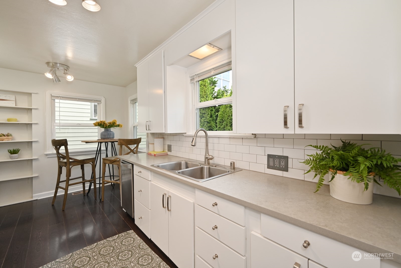 6037 Fauntleroy Way Southwest Seattle, WA 98136 - Photo 11 of 37 a kitchen with a sink and cabinets