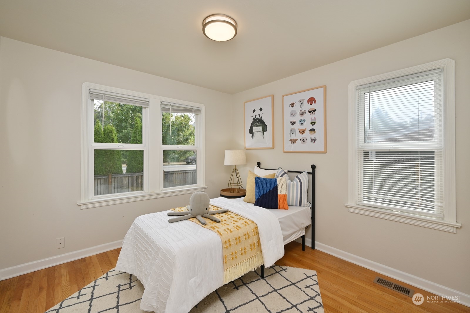 6037 Fauntleroy Way Southwest Seattle, WA 98136 - Photo 14 of 37 a bed room with a bed and a window