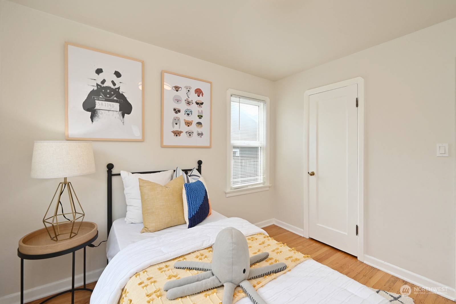 6037 Fauntleroy Way Southwest Seattle, WA 98136 - Photo 15 of 37 a bed room with a bed and a chair