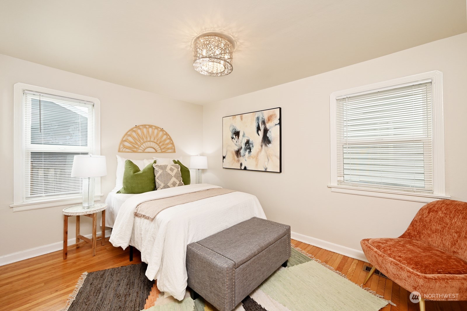 6037 Fauntleroy Way Southwest Seattle, WA 98136 - Photo 16 of 37 a bedroom with a bed and wooden floor