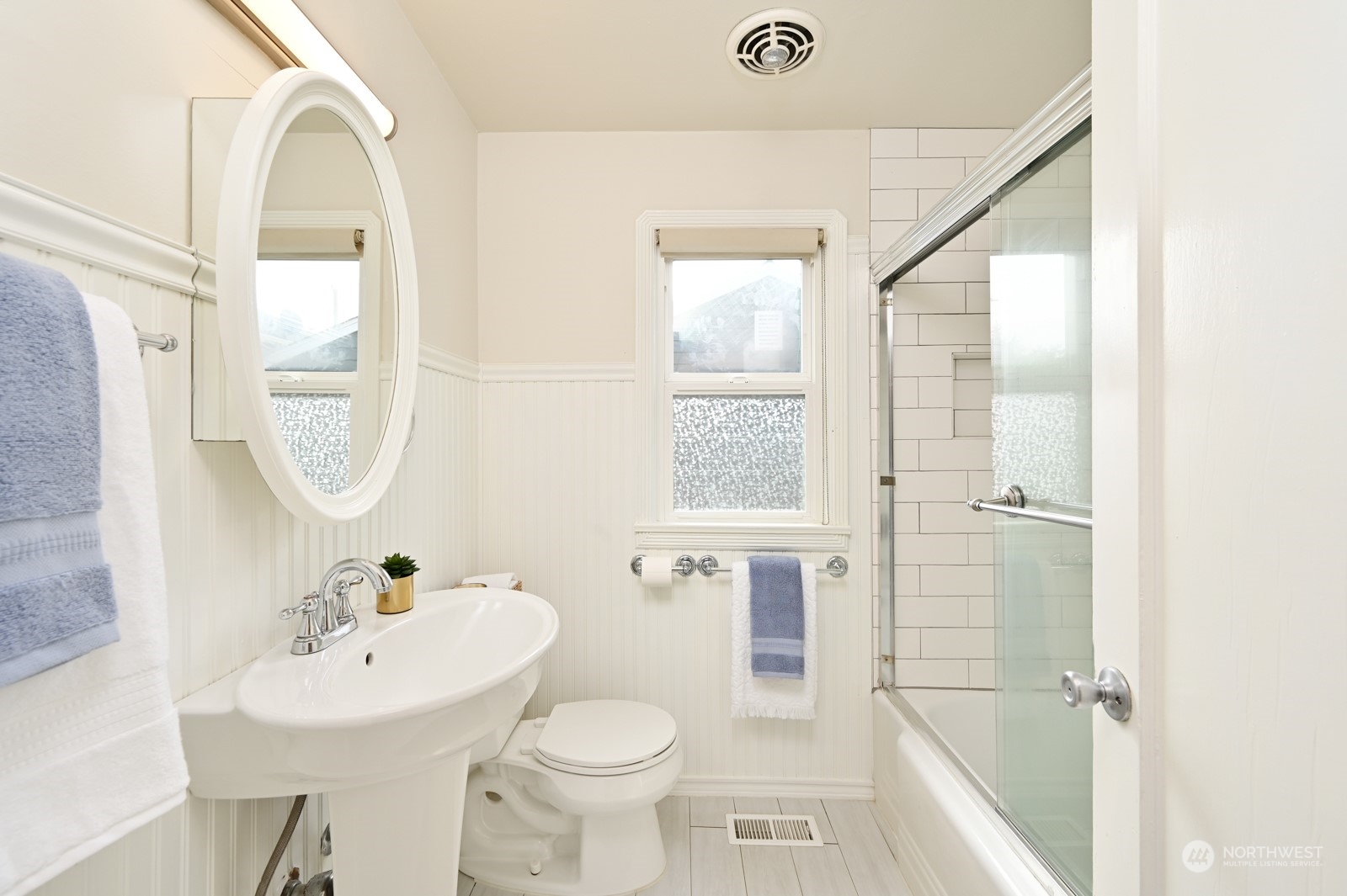 6037 Fauntleroy Way Southwest Seattle, WA 98136 - Photo 18 of 37 a bathroom with a sink a toilet and shower