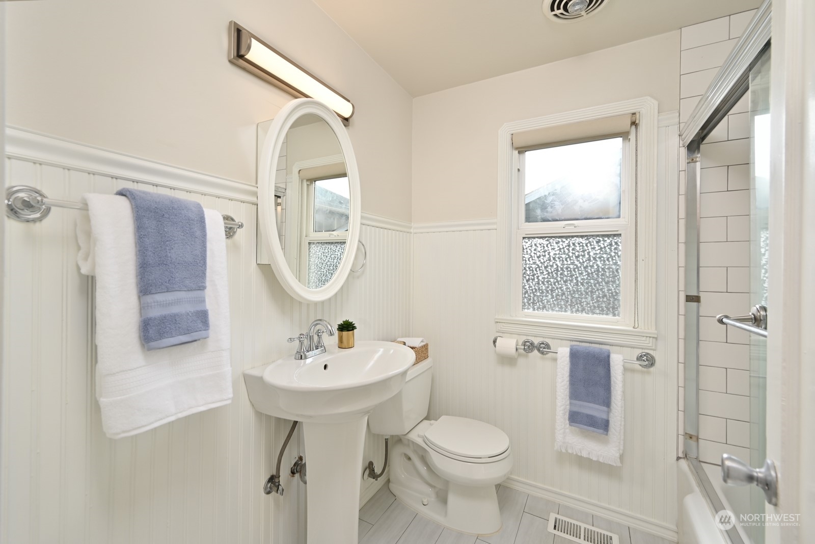 6037 Fauntleroy Way Southwest Seattle, WA 98136 - Photo 19 of 37 a bathroom with a sink toilet and shower