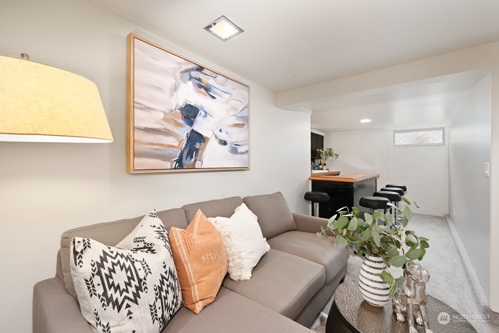 6037 Fauntleroy Way Southwest Seattle, WA 98136 - Photo 24 of 37 a living room with furniture and a large window