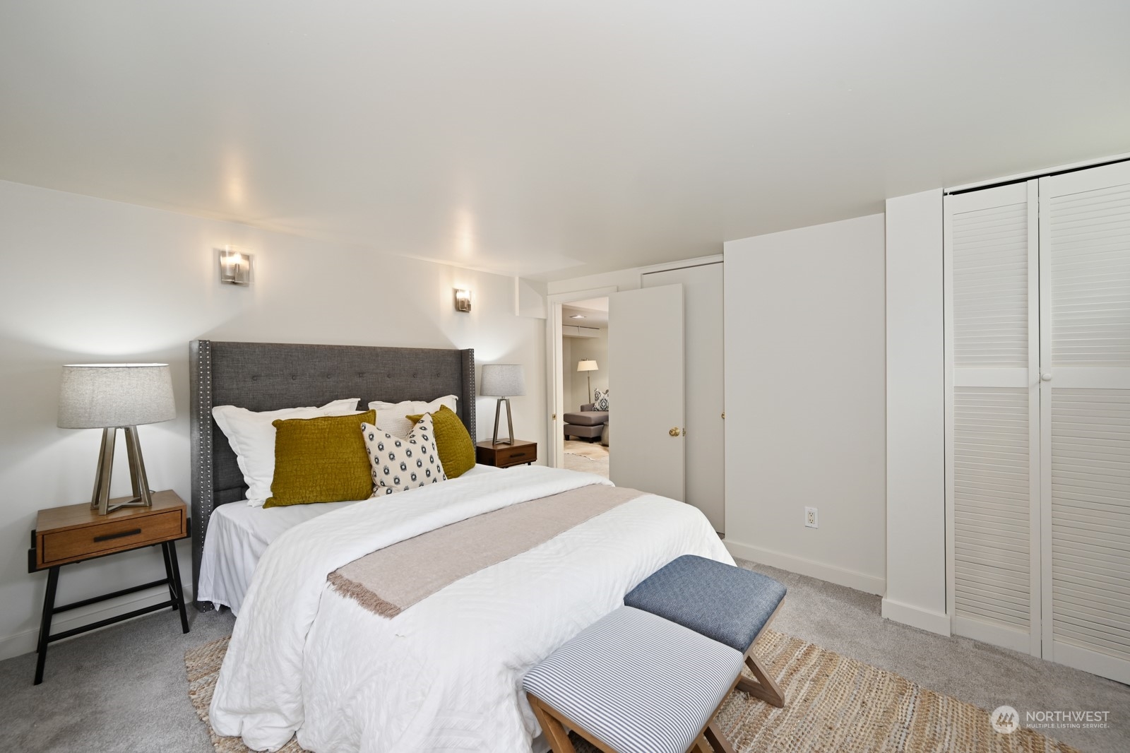 6037 Fauntleroy Way Southwest Seattle, WA 98136 - Photo 27 of 37 a bedroom with a bed and a night stand