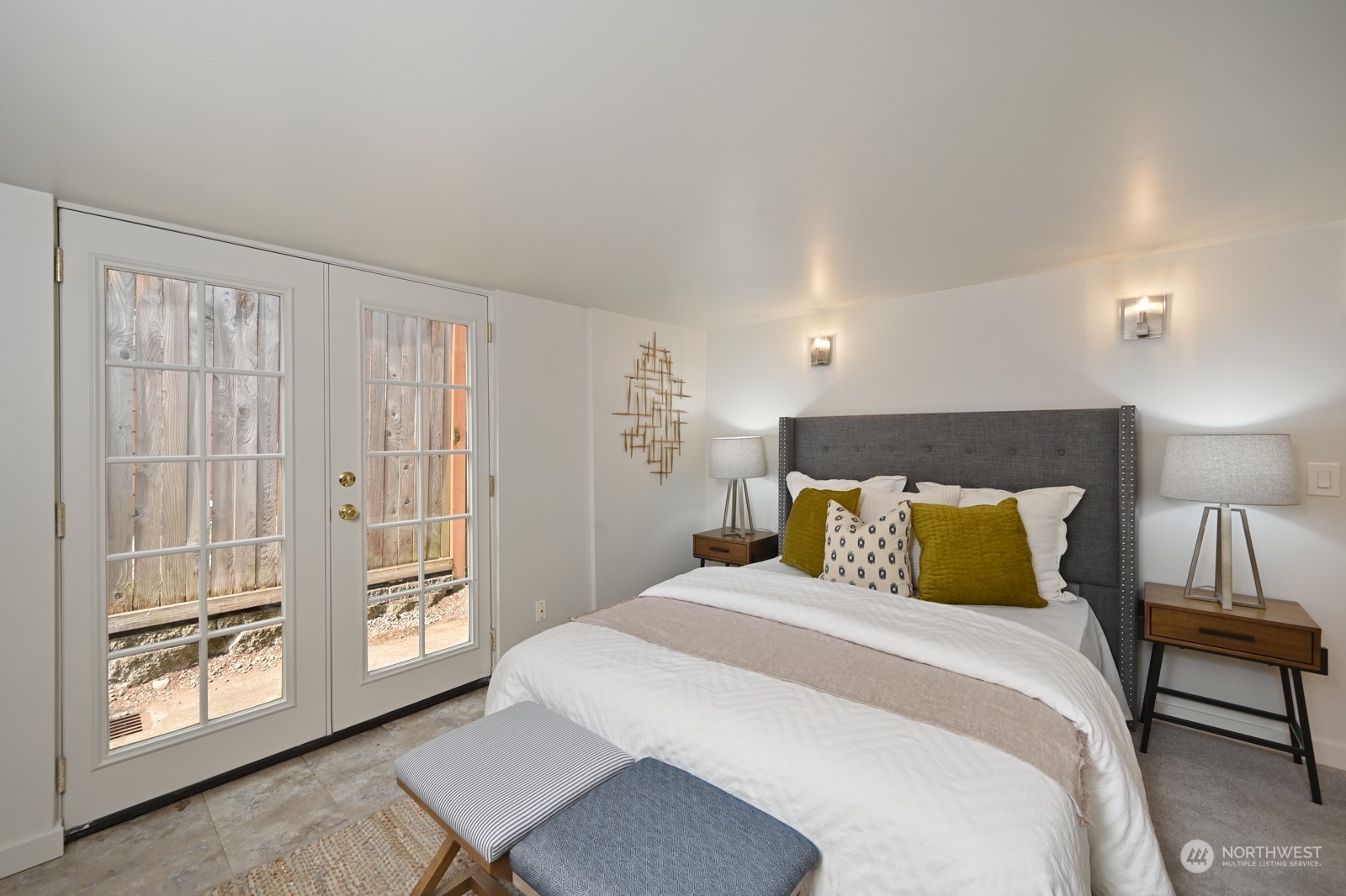 6037 Fauntleroy Way Southwest Seattle, WA 98136 - Photo 28 of 37 a bedroom with a large bed and a window