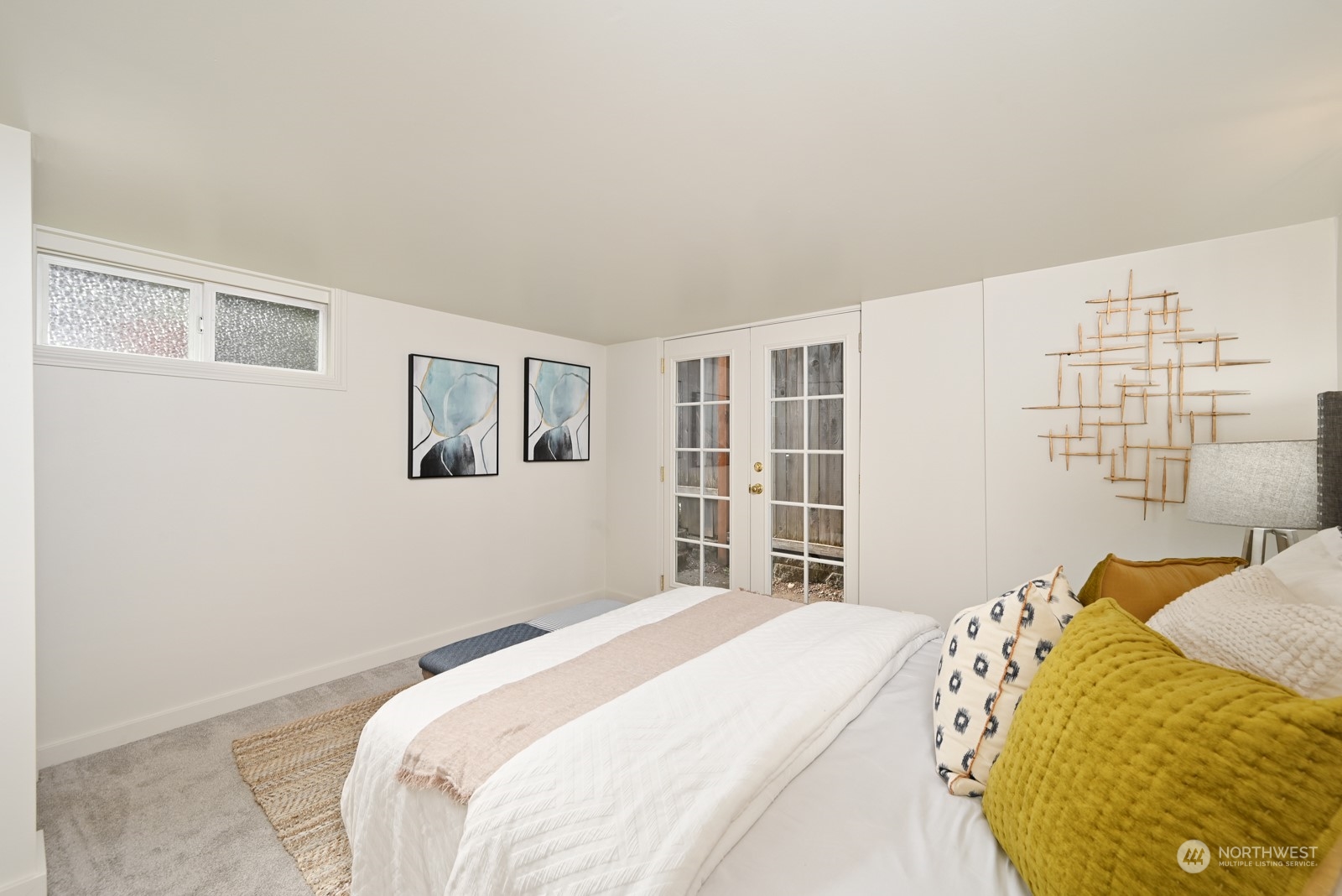 6037 Fauntleroy Way Southwest Seattle, WA 98136 - Photo 29 of 37 a bedroom with a bed and a window
