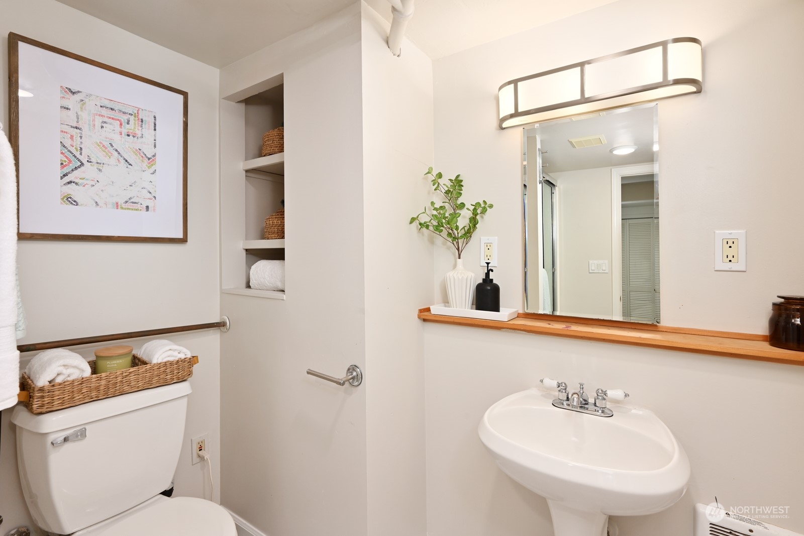 6037 Fauntleroy Way Southwest Seattle, WA 98136 - Photo 31 of 37 a bathroom with a toilet sink and mirror