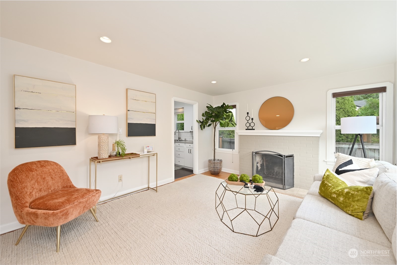 6037 Fauntleroy Way Southwest Seattle, WA 98136 - Photo 6 of 37 a living room with furniture and a fireplace