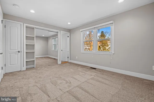 an empty room with a empty space and window