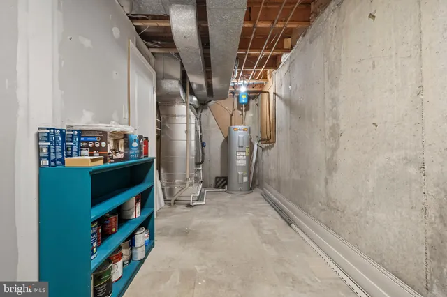 a view of a backyard with table and chairs and wooden fence
