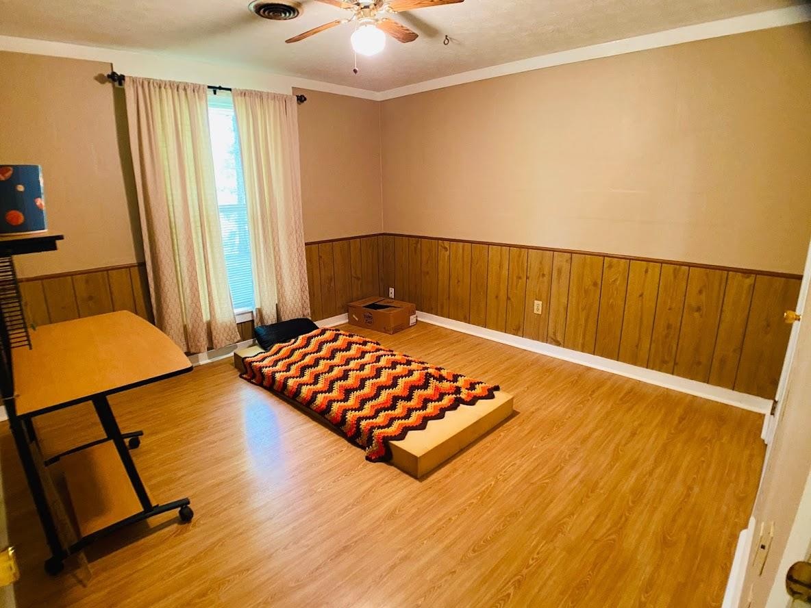 1034 Star Point Road Jamestown, TN 38556 - Photo 16 of 35 a bedroom with a bed and wooden floor