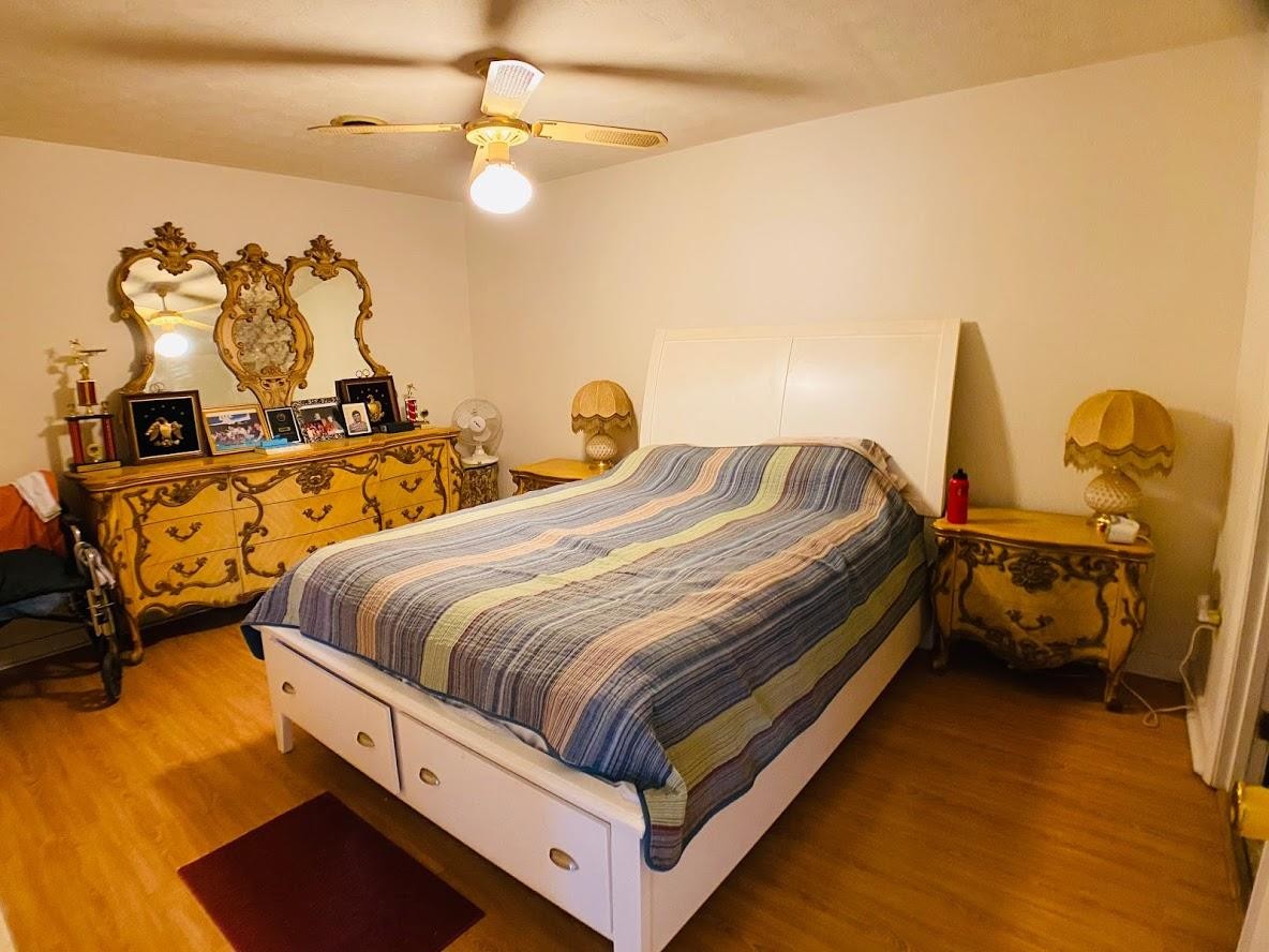 1034 Star Point Road Jamestown, TN 38556 - Photo 21 of 35 a bedroom with bed and a chandelier