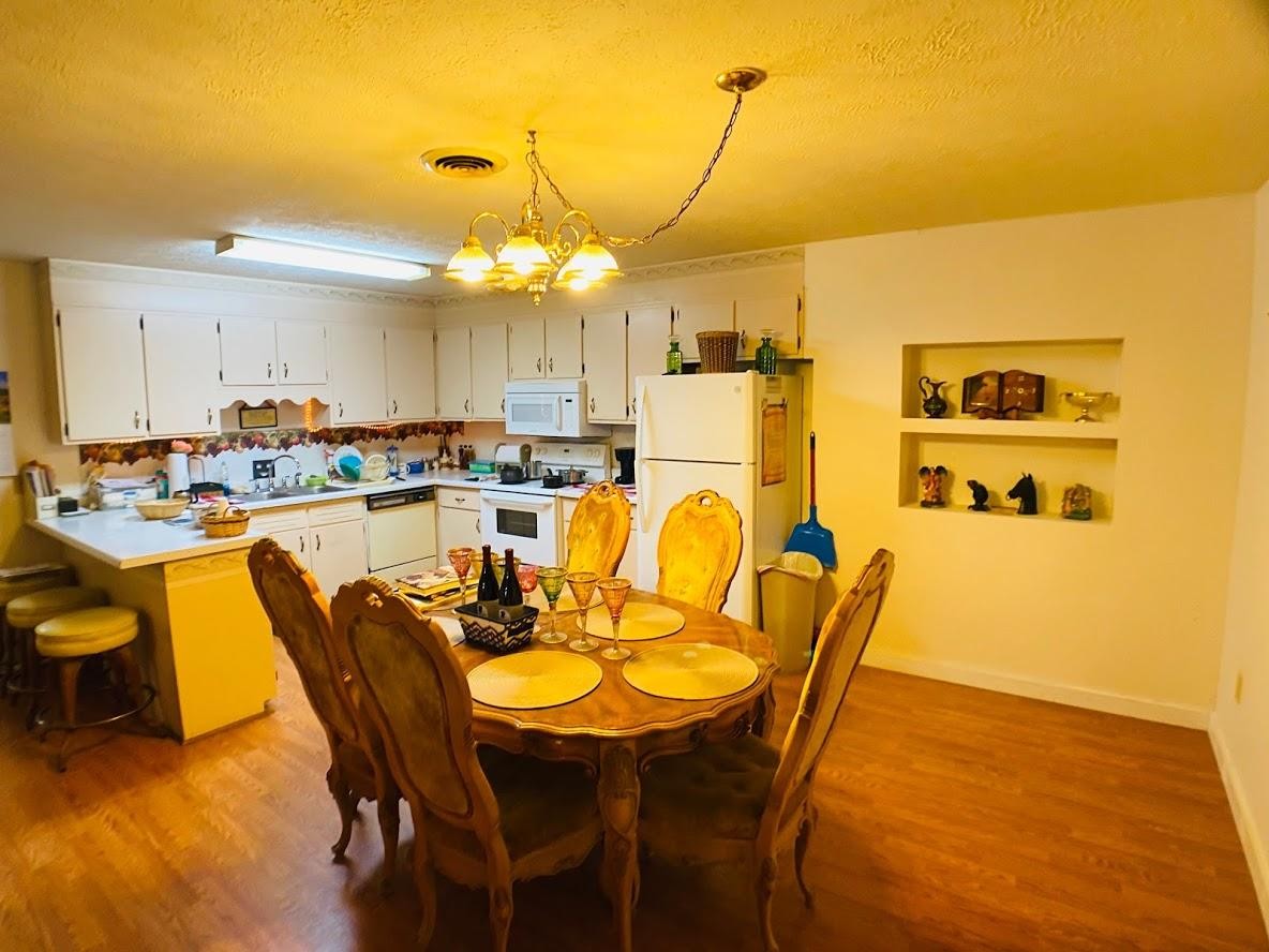 1034 Star Point Road Jamestown, TN 38556 - Photo 24 of 35 a view of a dining room with furniture and wooden floor