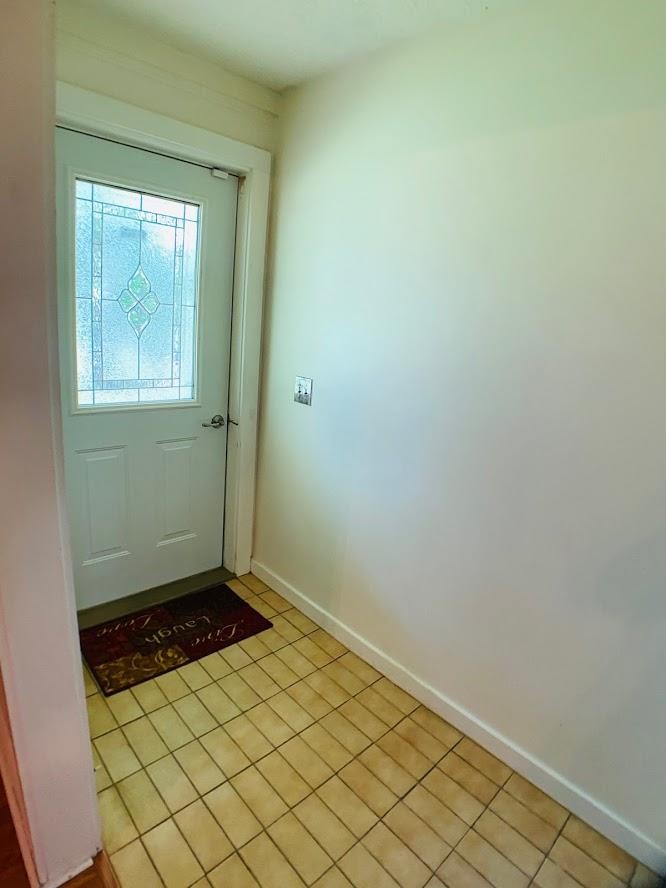 1034 Star Point Road Jamestown, TN 38556 - Photo 28 of 35 an empty room with wooden floor and a window