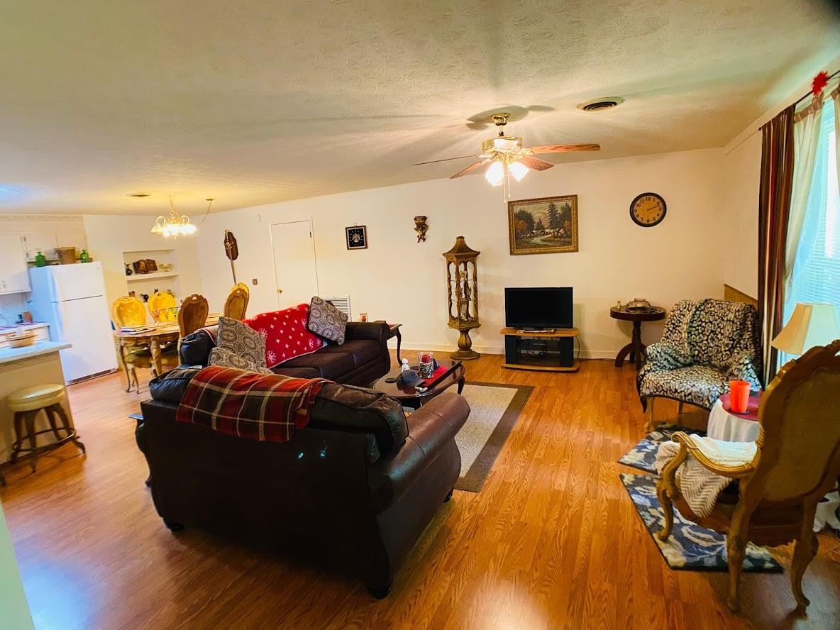 1034 Star Point Road Jamestown, TN 38556 - Photo 29 of 35 a living room with furniture and a fireplace