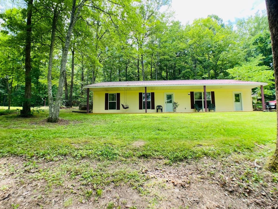 1034 Star Point Road Jamestown, TN 38556 - Photo 4 of 35 a view of an house with backyard space and garden