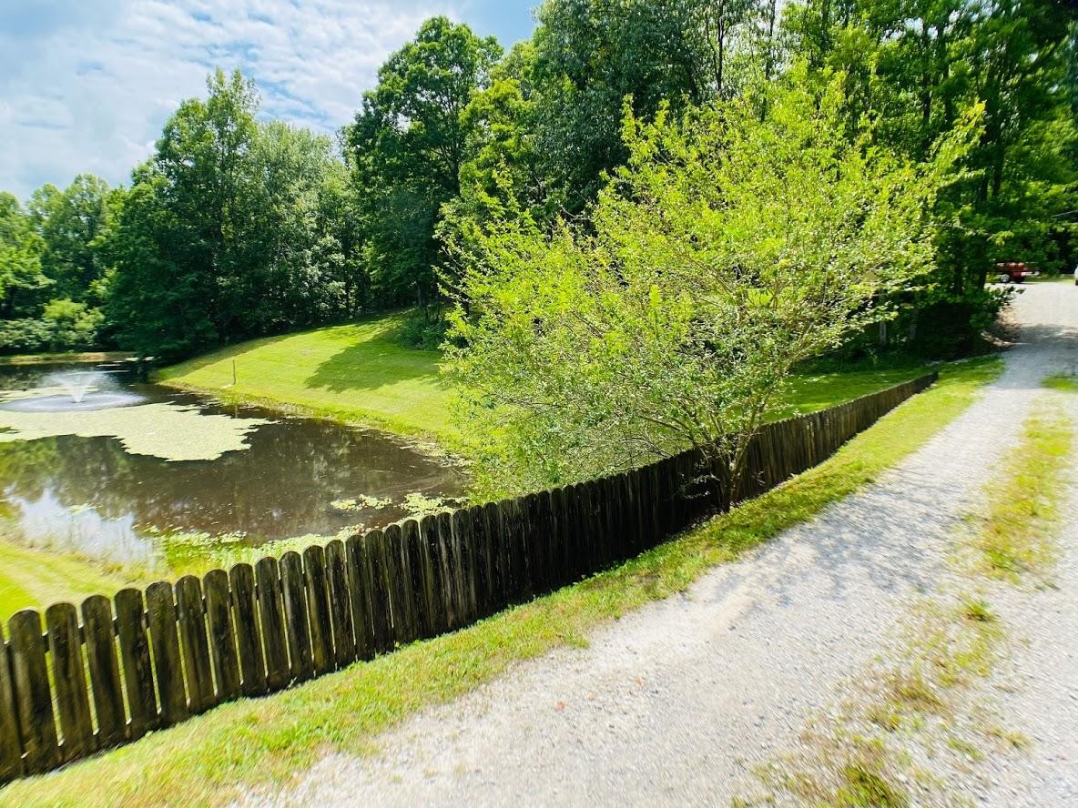 1034 Star Point Road Jamestown, TN 38556 - Photo 7 of 35 a view of a pathway of a garden with wooden fence