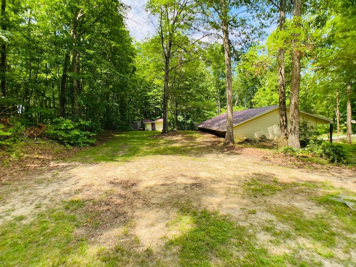 1034 Star Point Road Jamestown, TN 38556 - Photo 8 of 35 a view of a house with a yard and sitting area