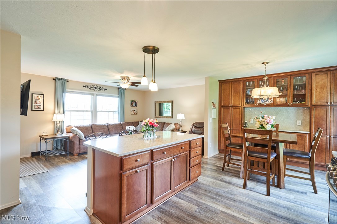 6214 Renninger Road Akron, OH 44319 - Photo 27 of 27 Kitchen with open floor plan, island with pin lighting, table space with built in cabinets and serving space too