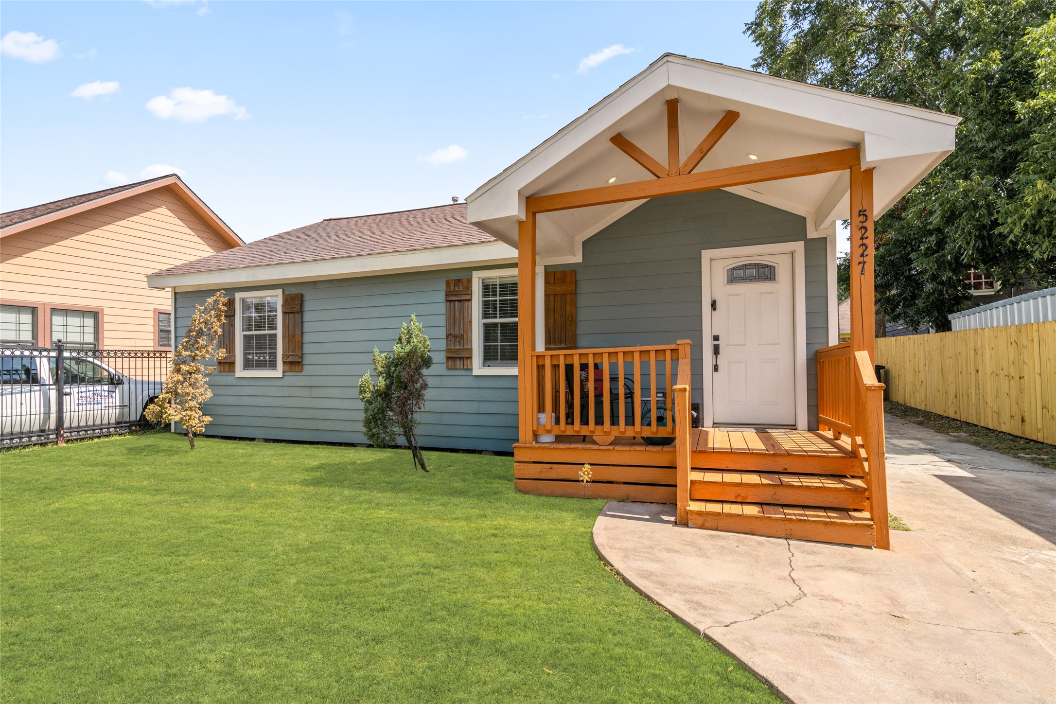 5227 Lawndale Street Houston, TX 77023 - Photo 1 of 32 a backyard of a house with table and sofas