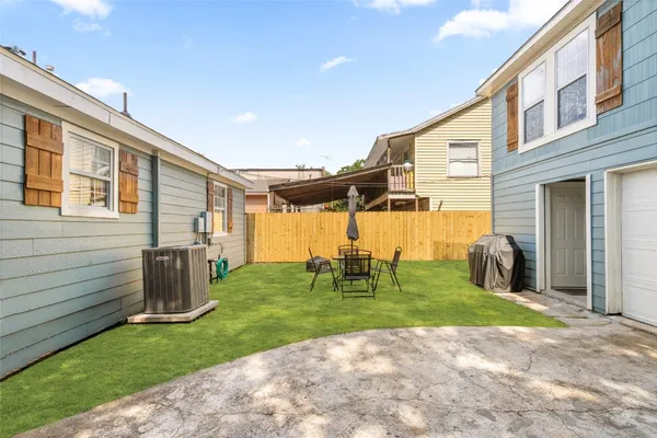 a view of a backyard with hardwood