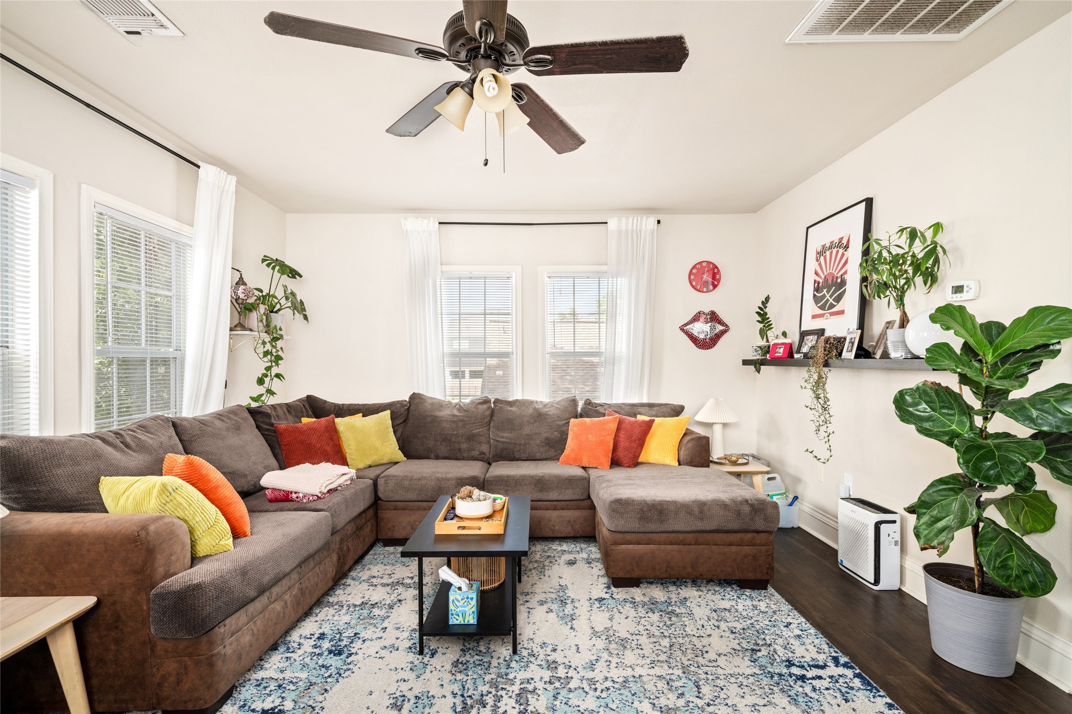 5227 Lawndale Street Houston, TX 77023 - Photo 17 of 32 a living room with furniture and a potted plant
