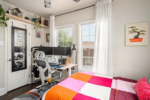 a room with furniture a rug and a window