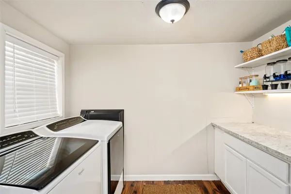 a utility room with dryer and washer