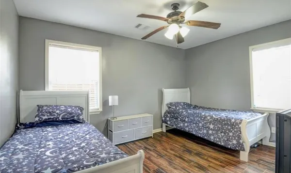 a bedroom with a bed and window