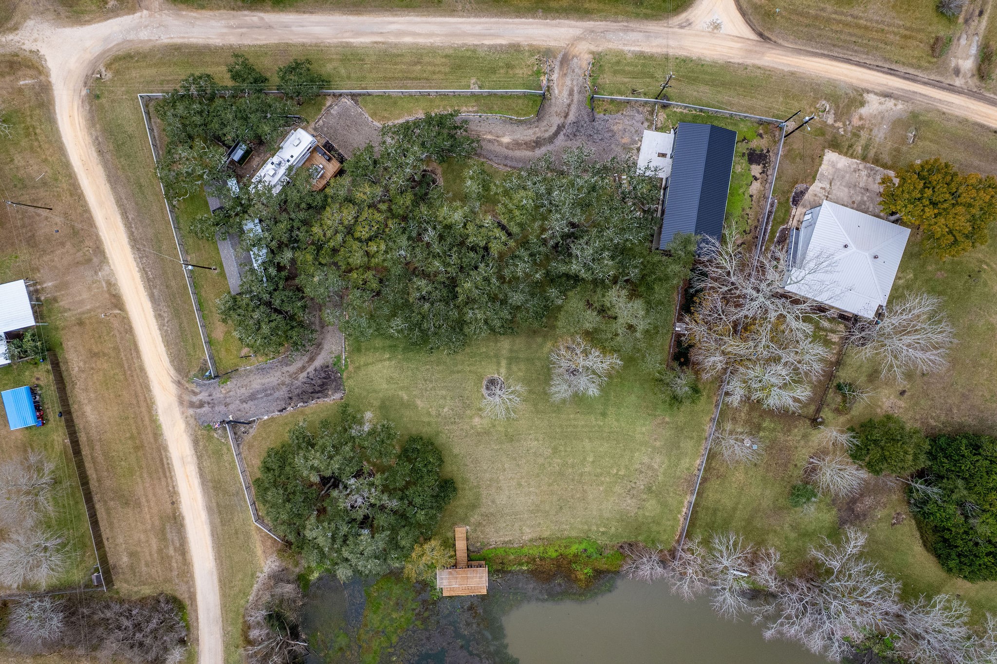 Aerial View of the entire fenced property.  Showing the two gated entrances, one off of Riverside Dr to the left & one off of Kings Hill off the front.  See next picture with labels