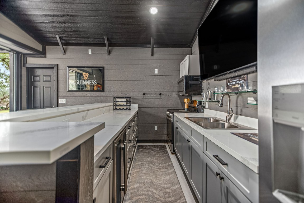 1236 Riverside Drive Palacios, TX 77465 - Photo 11 of 35 a kitchen with a sink stove and cabinets