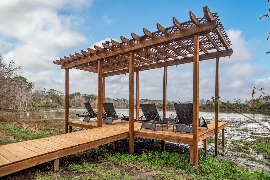1236 Riverside Drive Palacios, TX 77465 - Photo 16 of 35 a roof deck with table and chairs