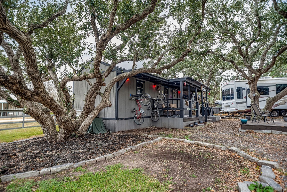 1236 Riverside Drive Palacios, TX 77465 - Photo 25 of 35 a front view of a house with garden