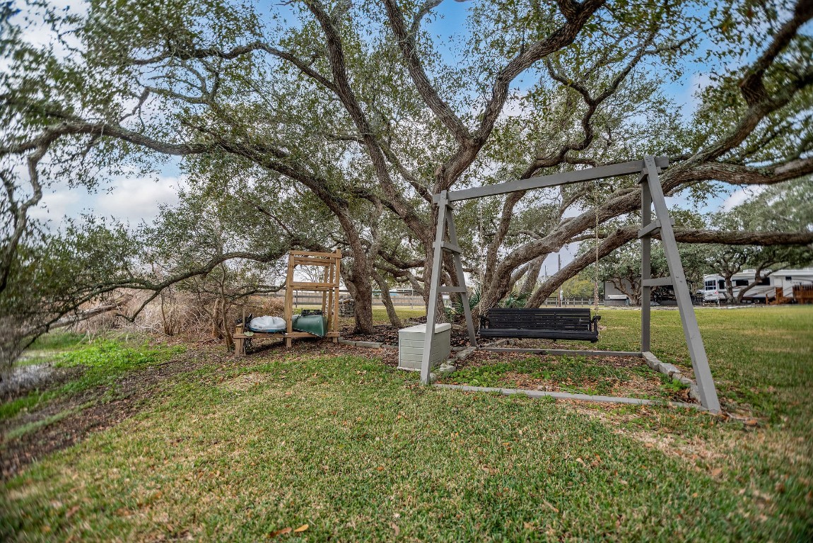 1236 Riverside Drive Palacios, TX 77465 - Photo 34 of 35 a view of a yard with of trees
