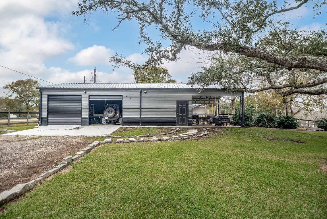 1236 Riverside Drive Palacios, TX 77465 - Photo 6 of 35 a view of a house with a yard and sitting area